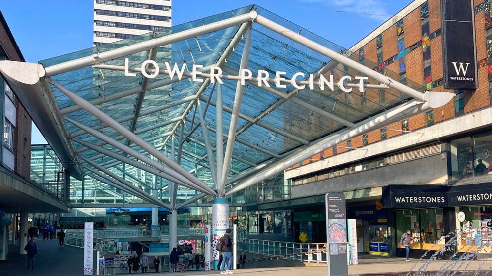 An image of the glass pavilion at the entrance to Lower Precinct shopping centre in Coventry.