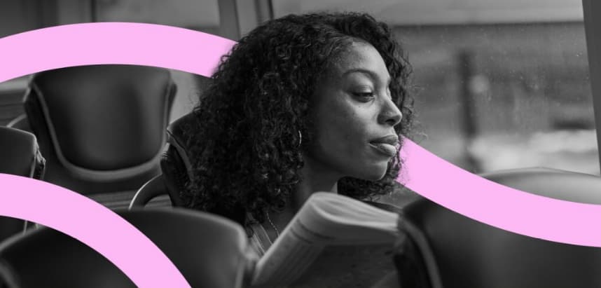 Person sitting on a bus seat, holding a newspaper, with pink curved lines overlaid
